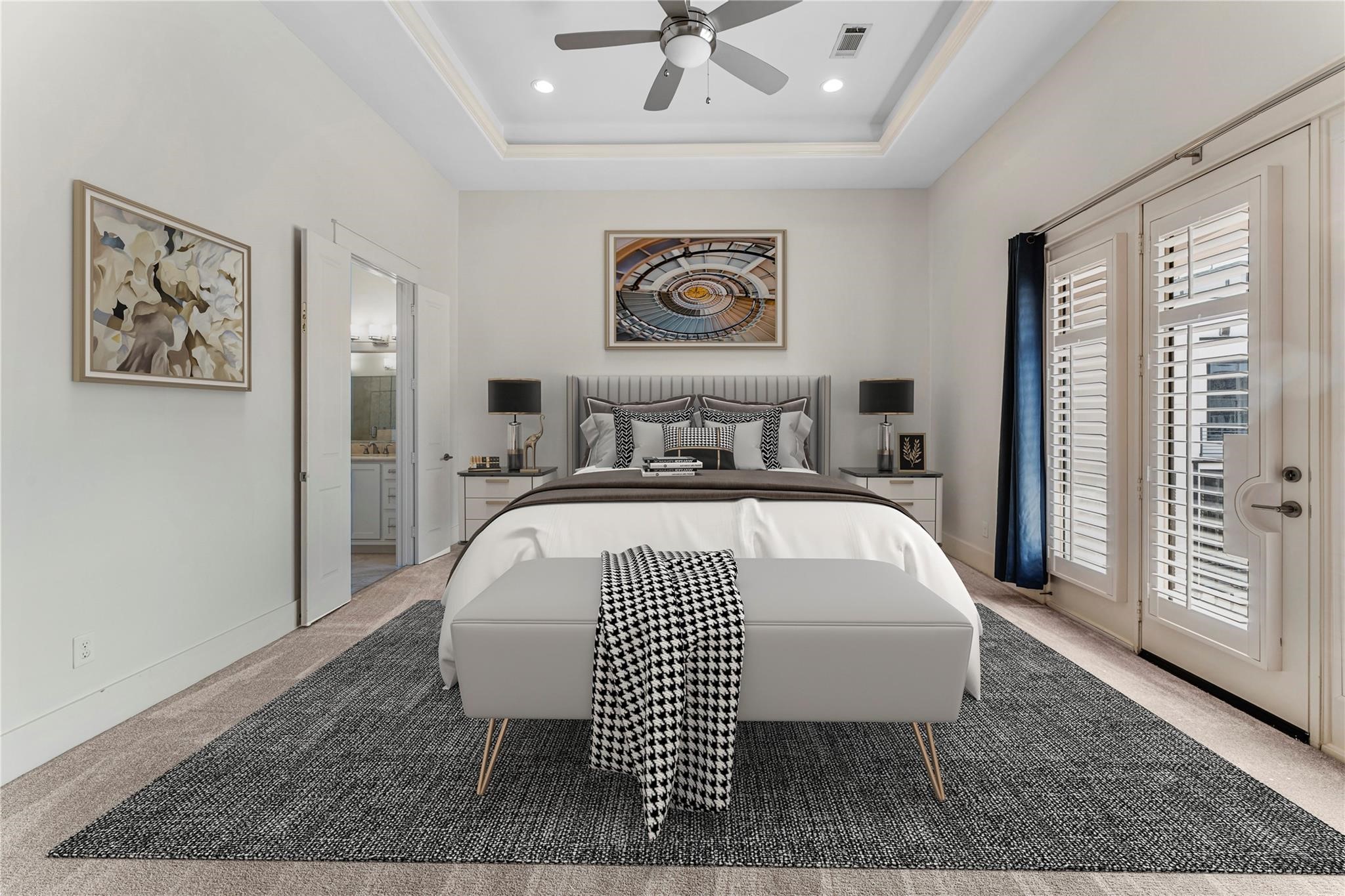 4938 Edison Park Lane Houston, TX 77081 - Photo 33 of 49 a bedroom with a large bed and a chandelier