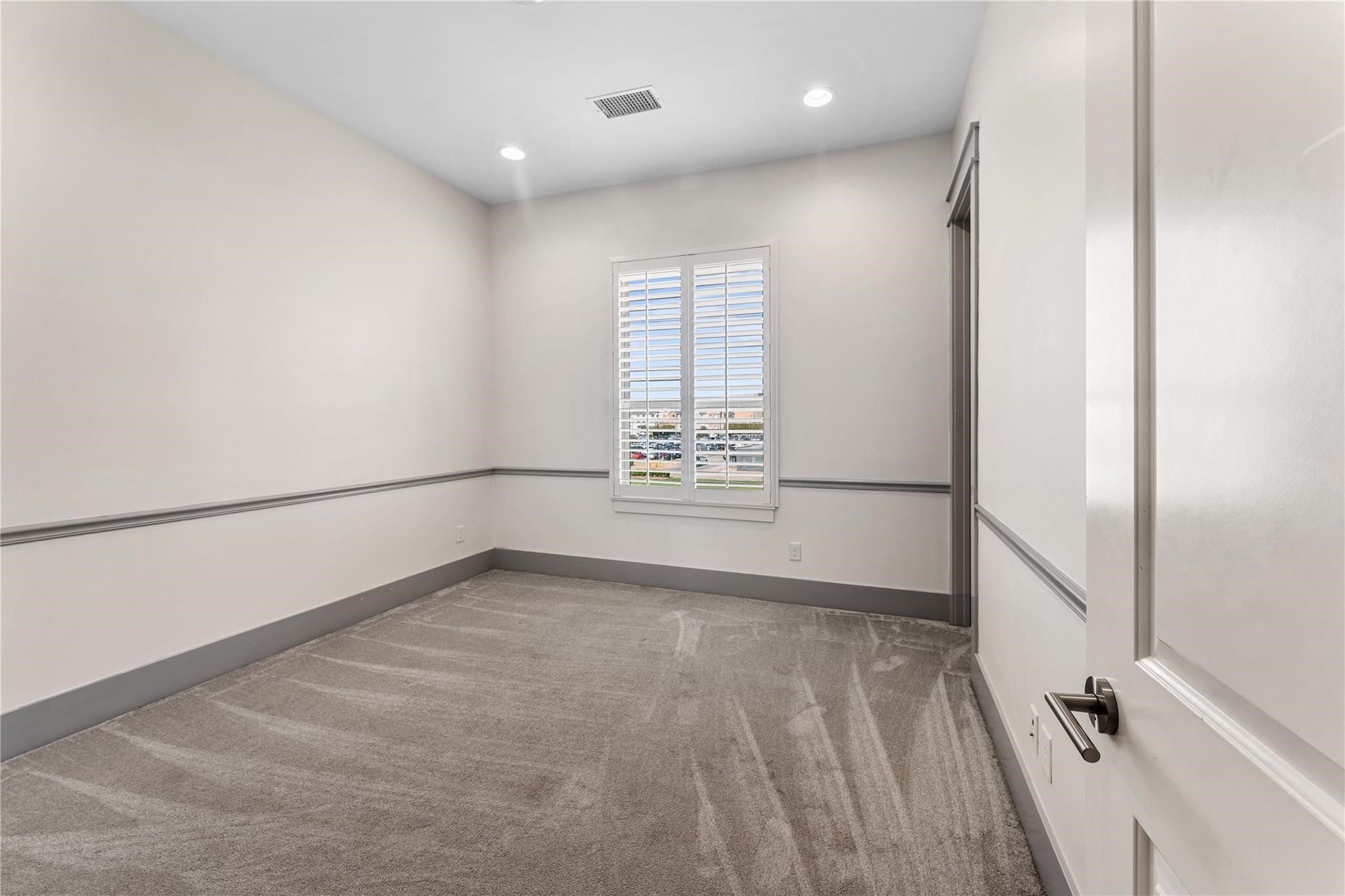 4938 Edison Park Lane Houston, TX 77081 - Photo 44 of 49 a view of an empty room with a window