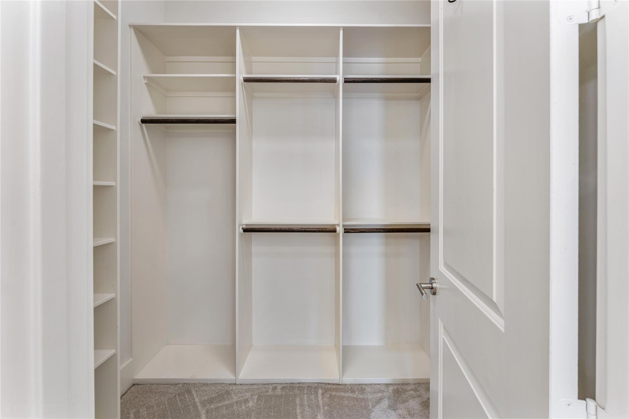 4938 Edison Park Lane Houston, TX 77081 - Photo 45 of 49 a view of closet area with empty racks