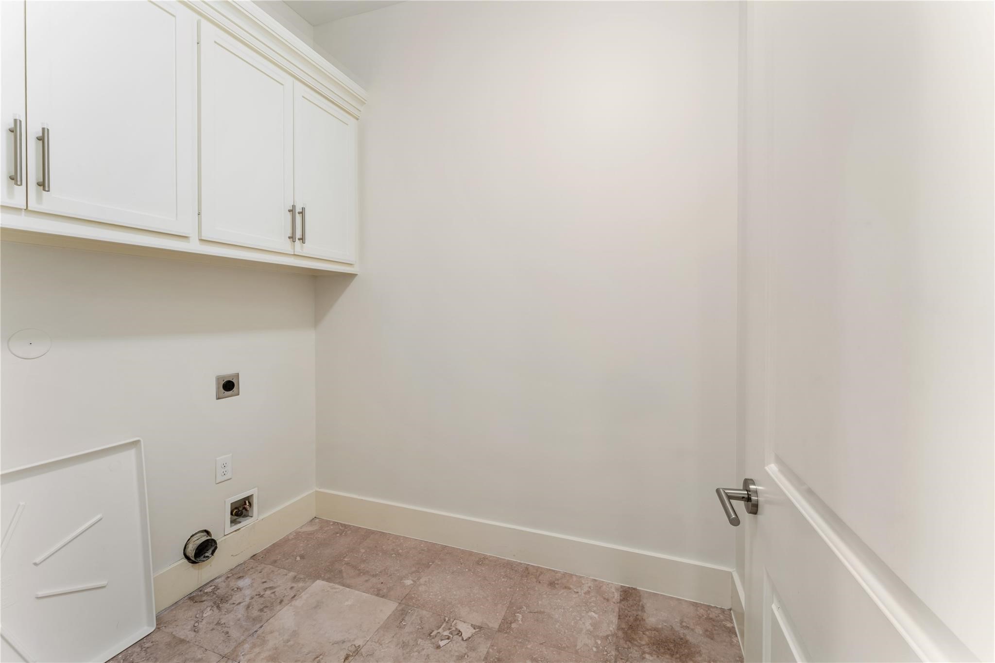 4938 Edison Park Lane Houston, TX 77081 - Photo 46 of 49 Conveniently located on the third
floor, the laundry room is
thoughtfully designed with built-
in cabinetry for added storage
and organization. Positioned
near the bedrooms, it enhances
everyday functionality and ease.
Every detail of this home has
been carefully considered to
elevate both comfort and
convenience.