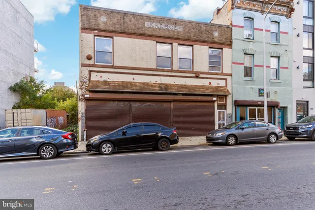 a view of cars parked in front of a building