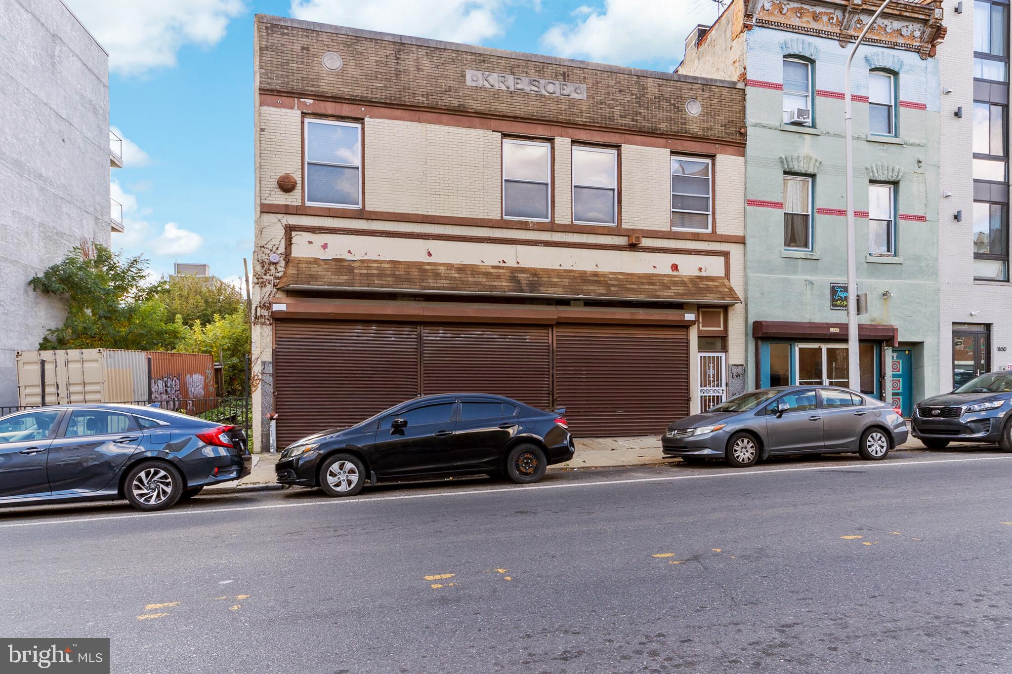 a view of cars parked in front of a building