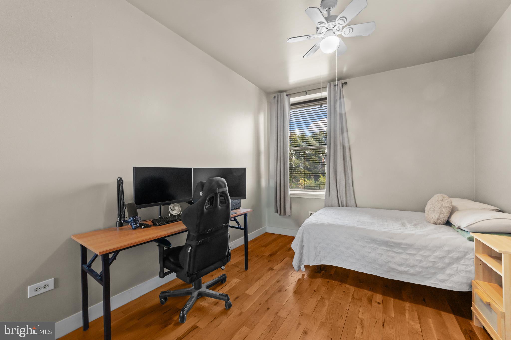 1642-44 Ridge Avenue Philadelphia, PA 19130 - Photo 13 of 24 a bedroom with a bed and a flat screen tv