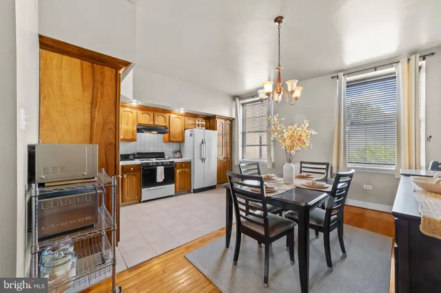 a view of a dining room with furniture and window