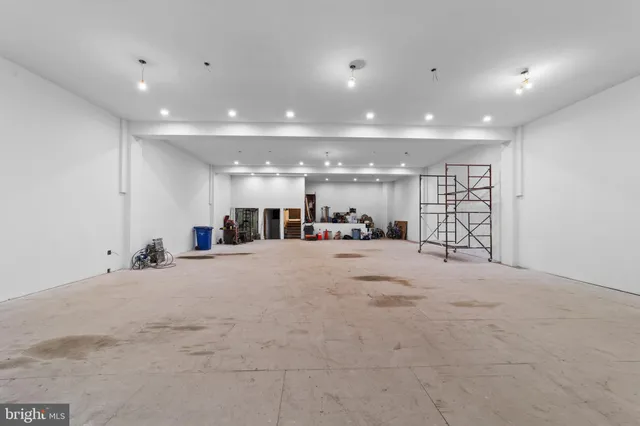 a view of the hall and a refrigerator