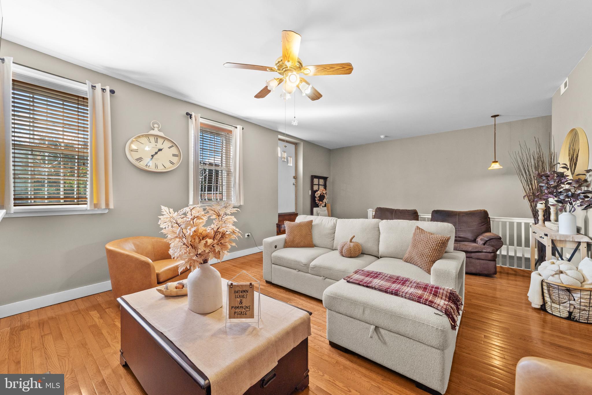 1642-44 Ridge Avenue Philadelphia, PA 19130 - Photo 6 of 24 a living room with furniture a chandelier and a large window