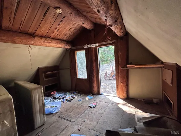 a bedroom with furniture and a window