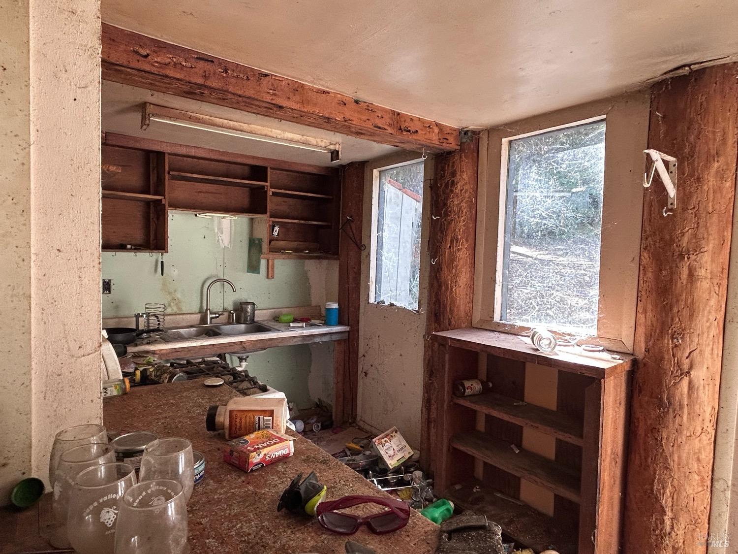 73046 Hill Road Covelo, CA 95428 - Photo 24 of 34 a room with a wooden floor and cabinets