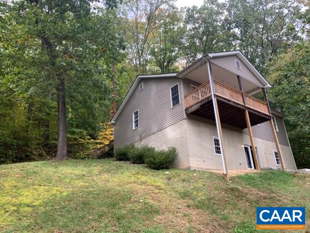 344 High Ridge Road Stanardsville, VA 22973 - Photo 1 of 9 a view of a house with a yard