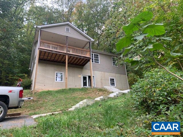344 High Ridge Road Stanardsville, VA 22973 - Photo 2 of 9 a front view of a house with garden