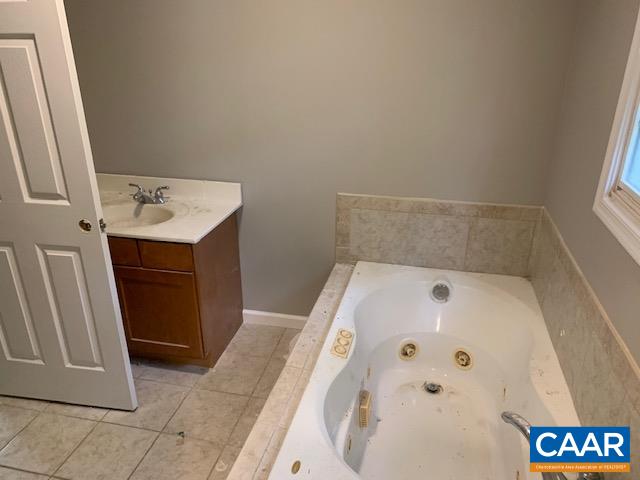 344 High Ridge Road Stanardsville, VA 22973 - Photo 9 of 9 a bathroom with a bathtub and sink