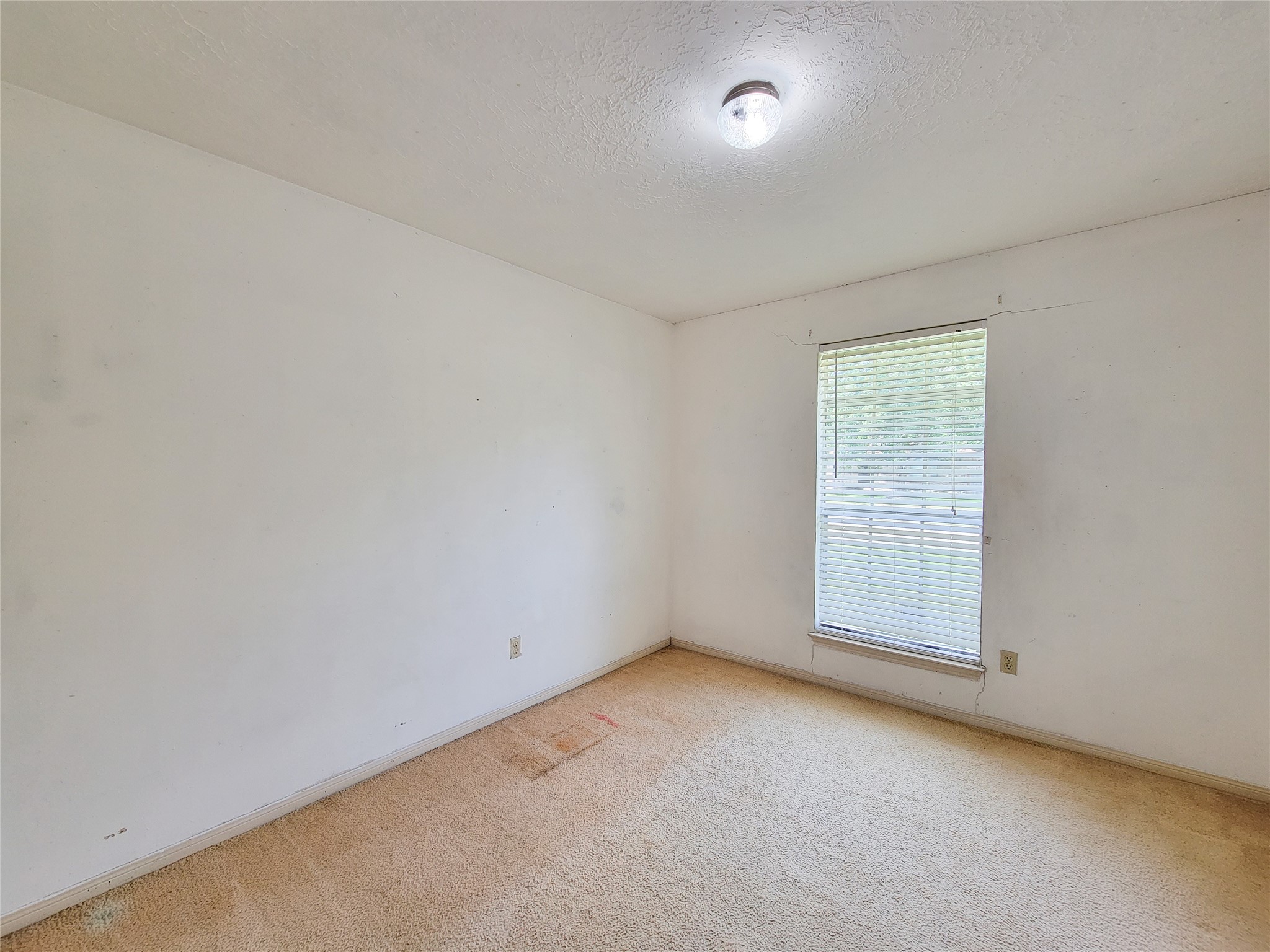 23211 Timberbrook Drive Spring, TX 77373 - Photo 21 of 34 an empty room with a window