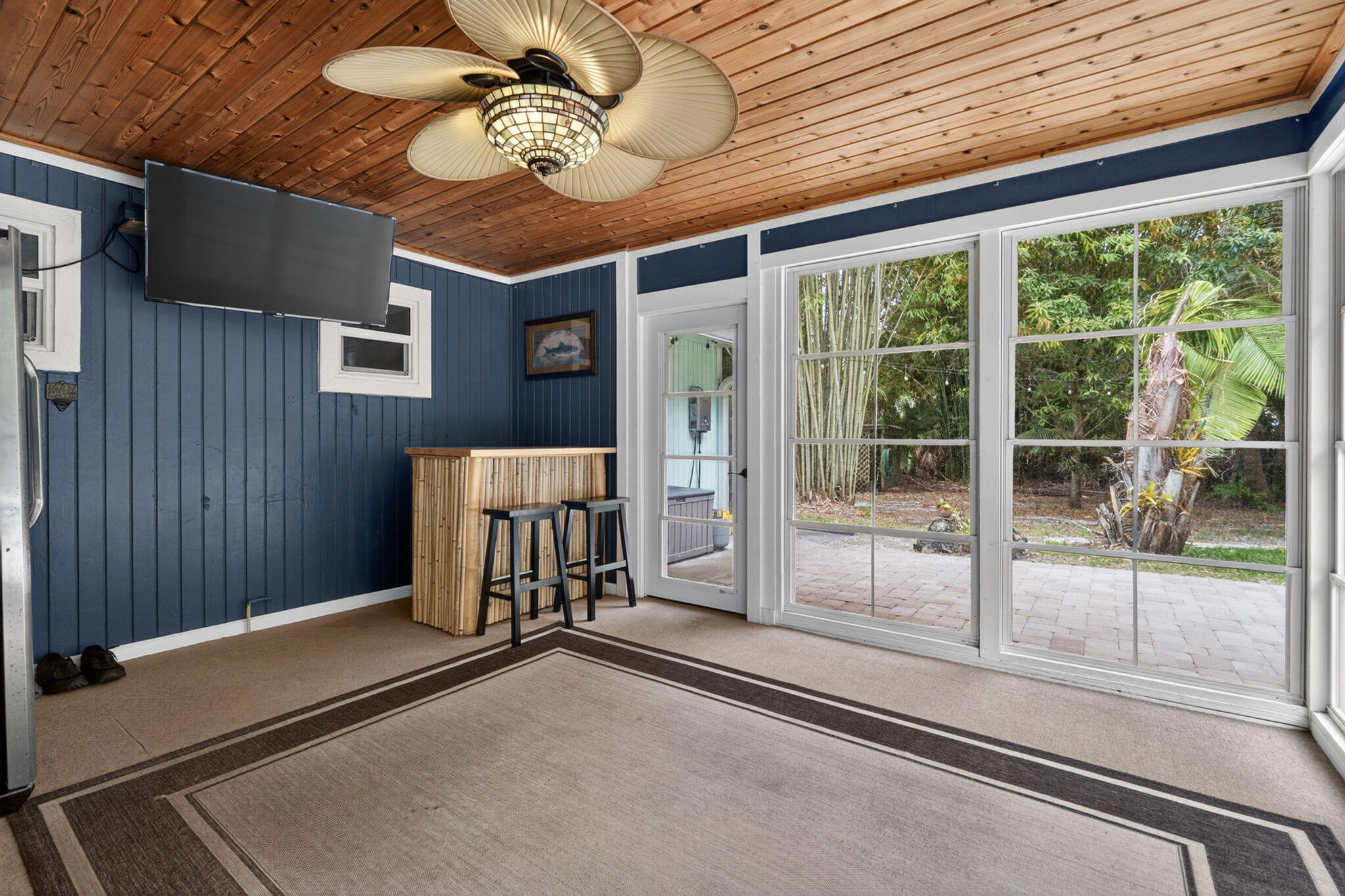17391 Alexander Run Jupiter, FL 33478 - Photo 30 of 55 a view of a livingroom with a ceiling fan and a large window