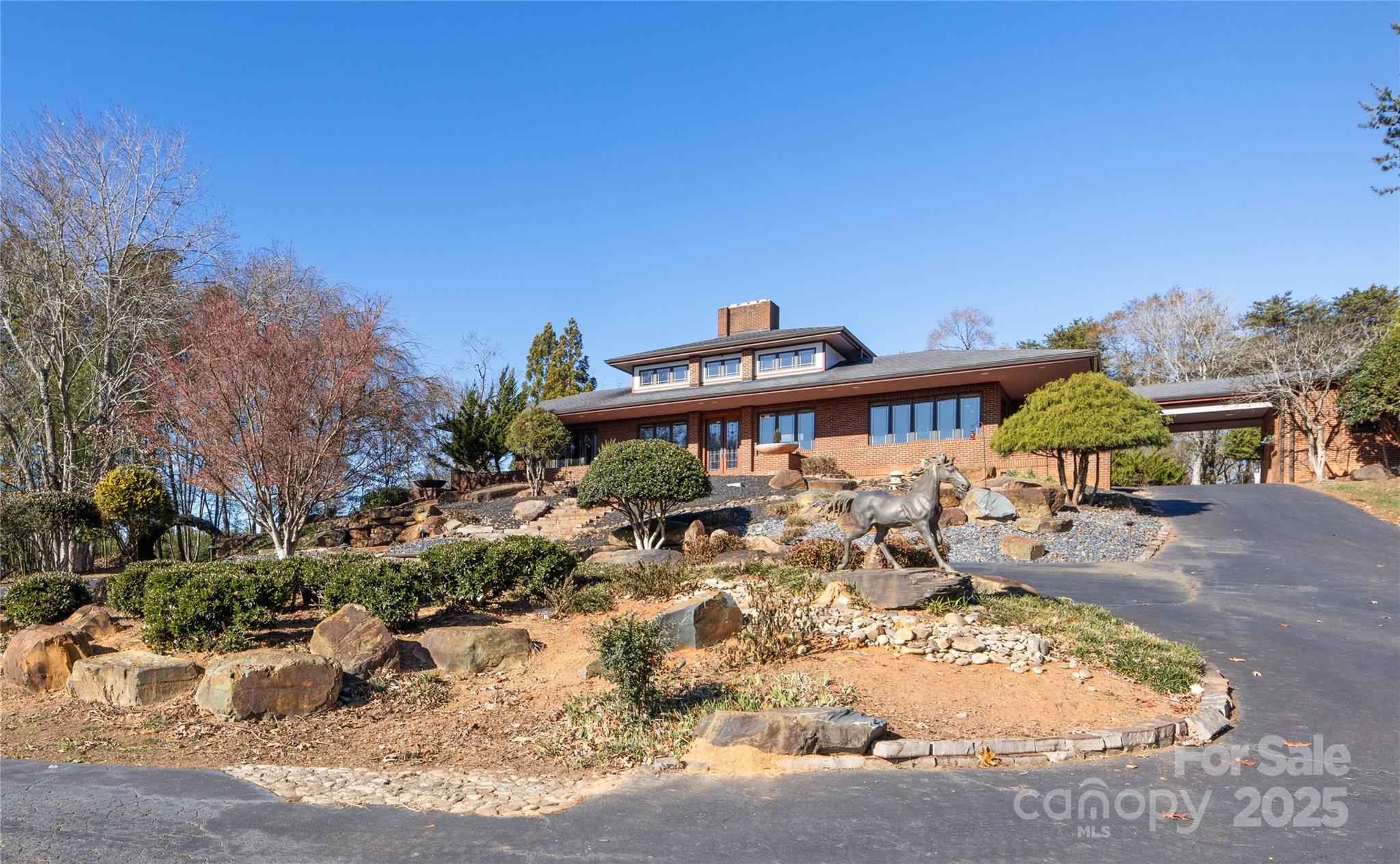a view of a patio with table and chairs under an umbrella
