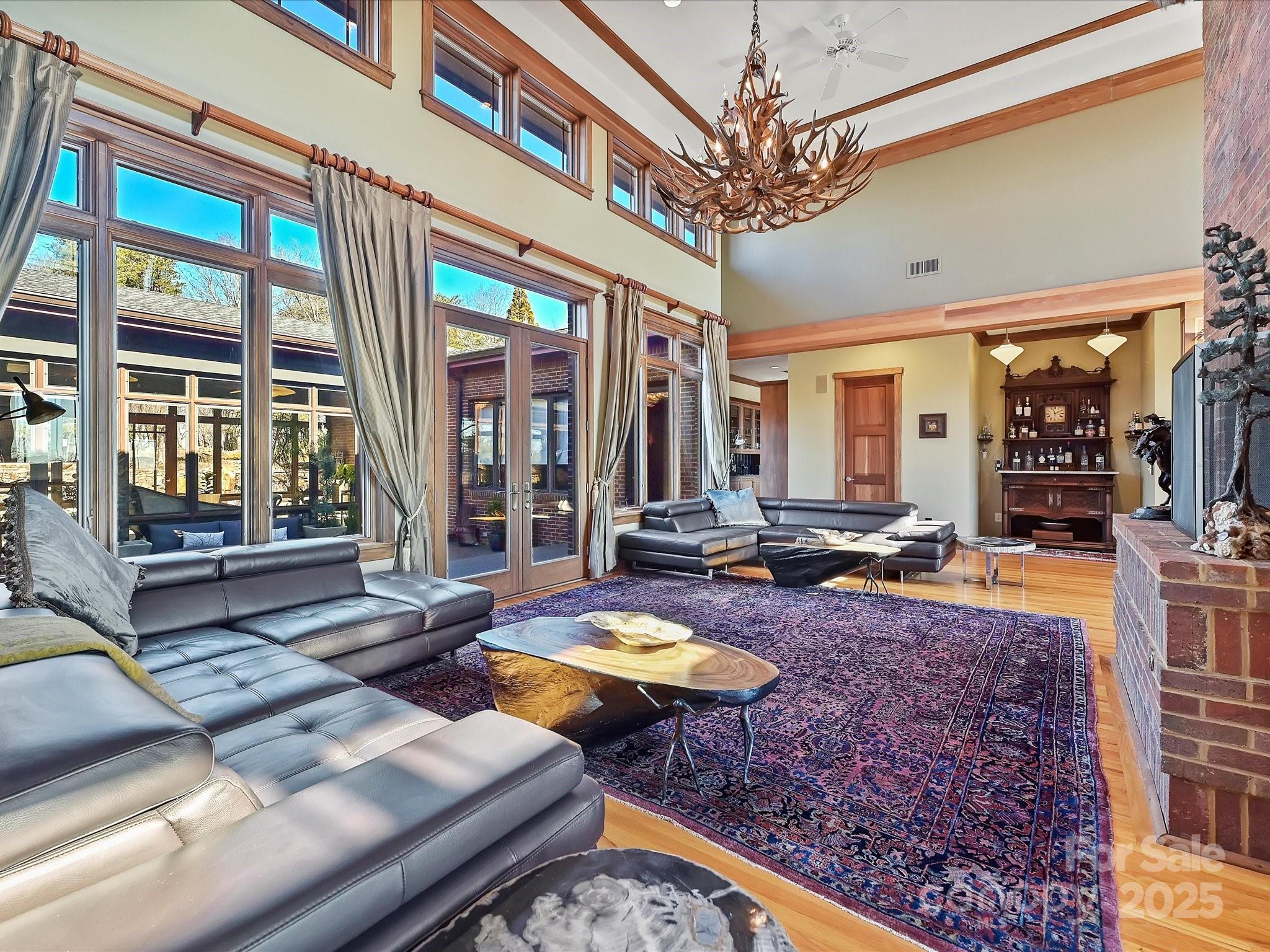172 Tuckertown Road New London, NC 28127 - Photo 16 of 47 a living room with fireplace furniture and a large window