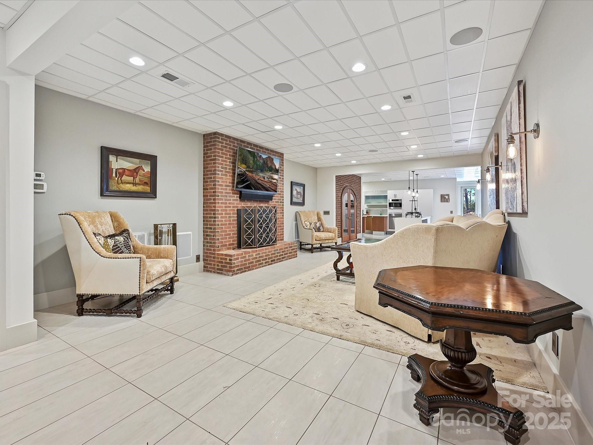 172 Tuckertown Road New London, NC 28127 - Photo 25 of 47 a living room with furniture a flat screen tv and a table