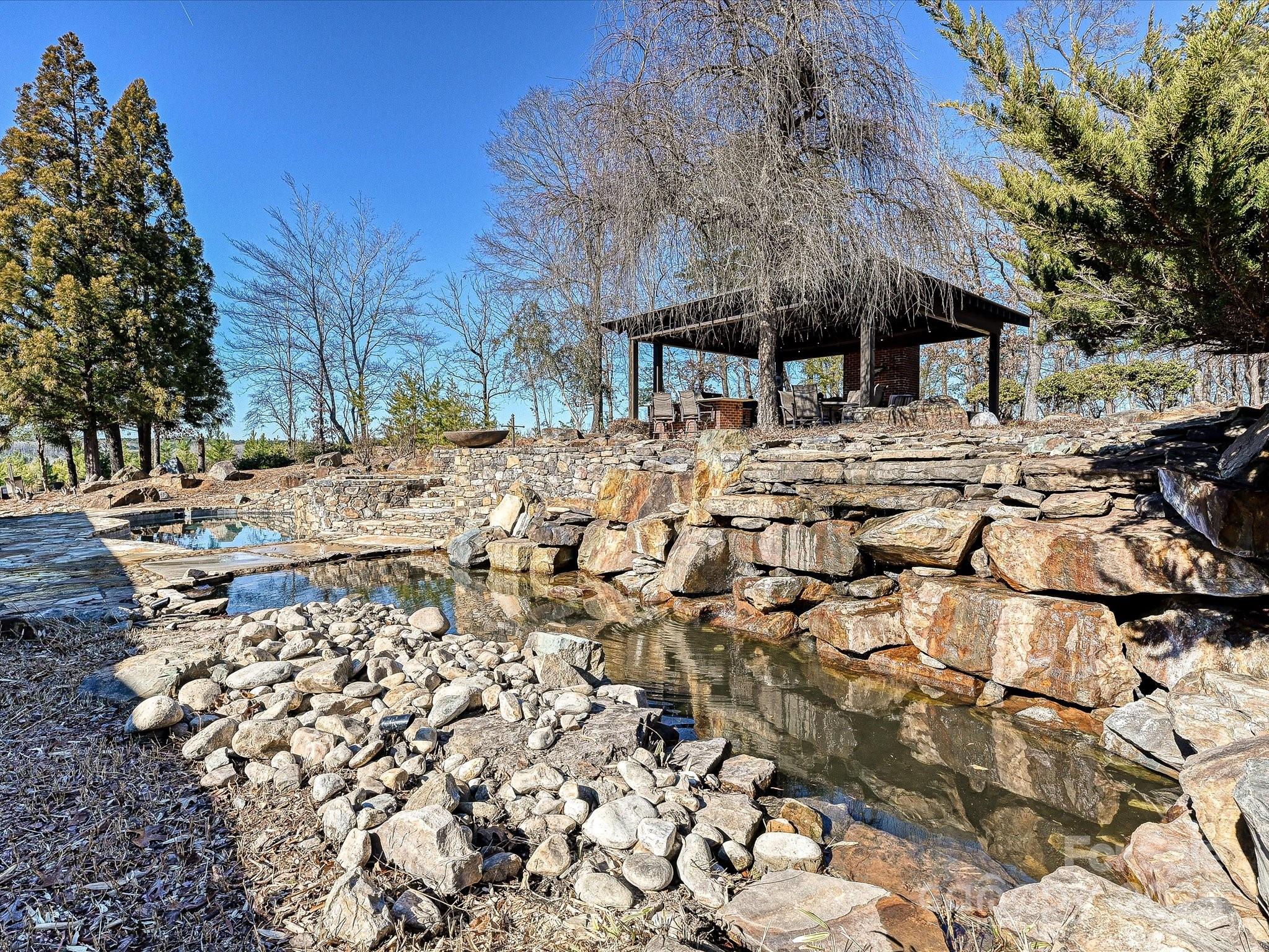 172 Tuckertown Road New London, NC 28127 - Photo 7 of 47 a view of house with yard and sitting area