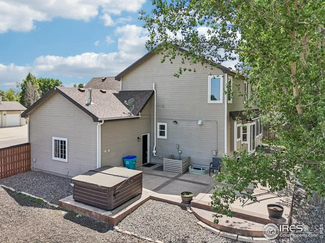 a front view of a house with yard and green space