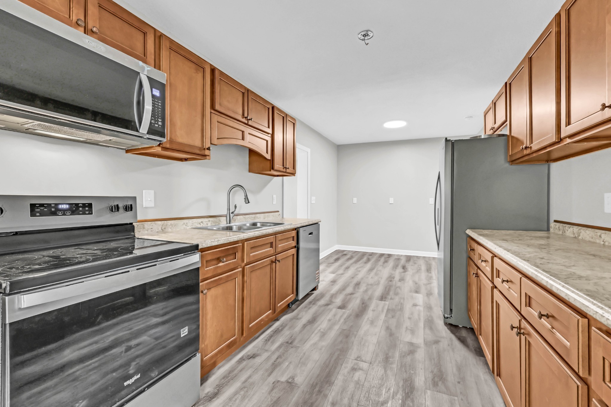 3436 State Highway 48 Cunningham, TN 37052 - Photo 17 of 45 a kitchen with stainless steel appliances granite countertop a stove and a sink