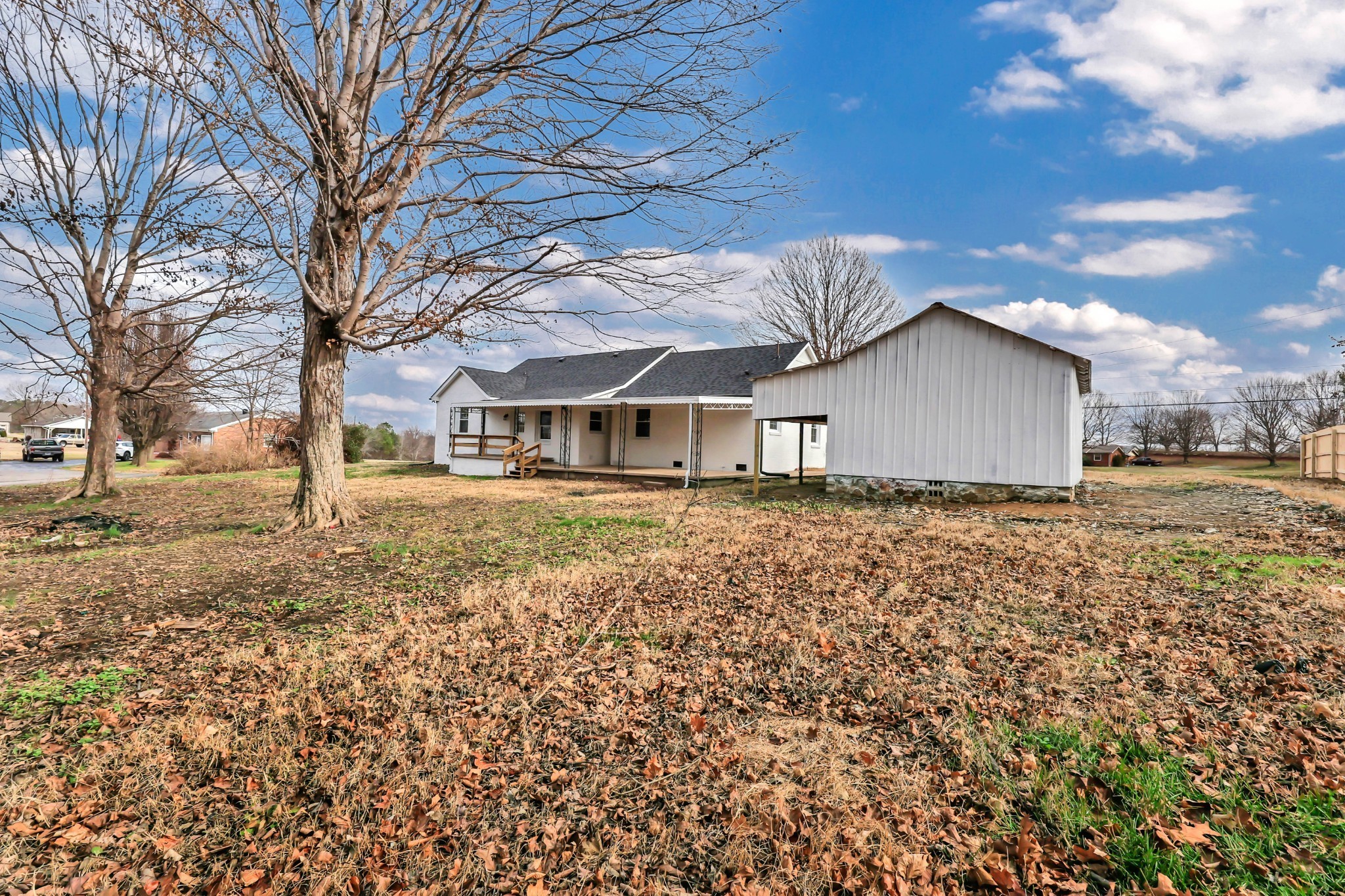 3436 State Highway 48 Cunningham, TN 37052 - Photo 42 of 45 a house with trees in front of it