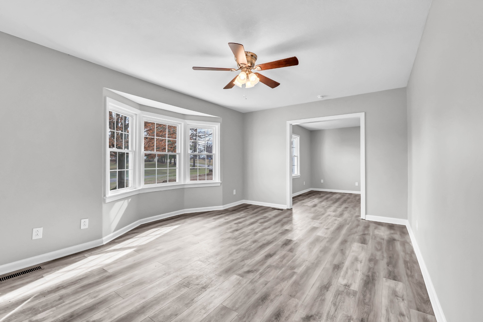 3436 State Highway 48 Cunningham, TN 37052 - Photo 10 of 45 a view of empty room with wooden floor and fan