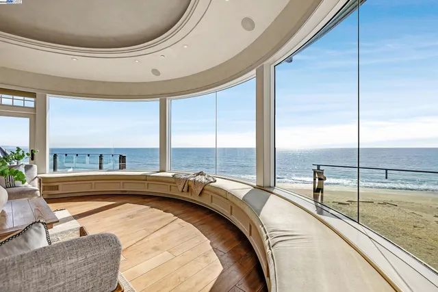 a view of a living room and floor to ceiling window