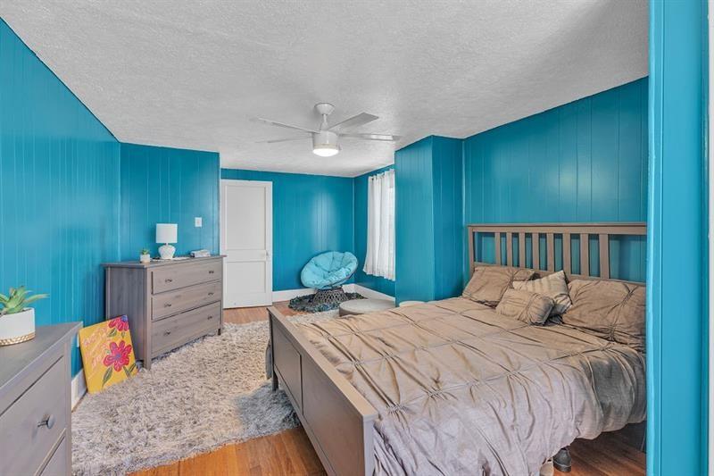 3159 Brodhead Road Aliquippa, PA 15001 - Photo 13 of 30 a bedroom with a bed and a chandelier