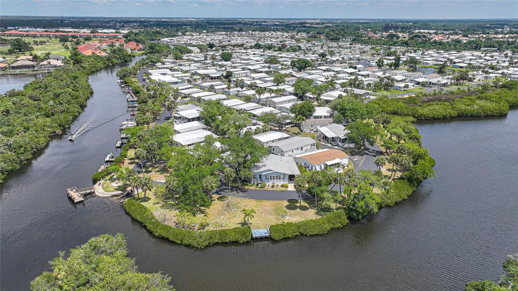 10303 Burnt Store Road, Unit 143 Punta Gorda, FL 33950 - Photo 26 of 42 a view of a lake with a building