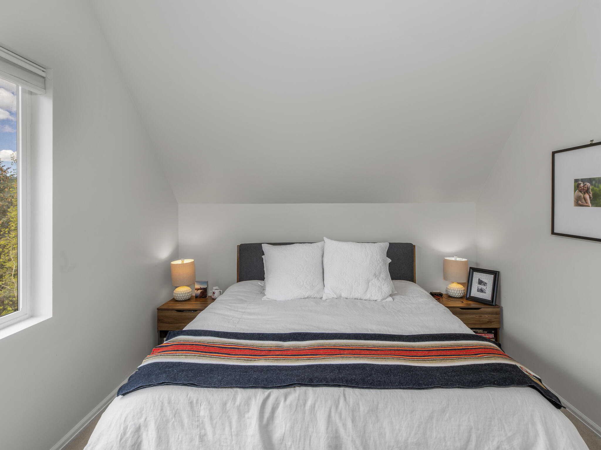 165 Alexander Overlook Telluride, CO 81435 - Photo 20 of 27 a bedroom with a bed and wooden floor
