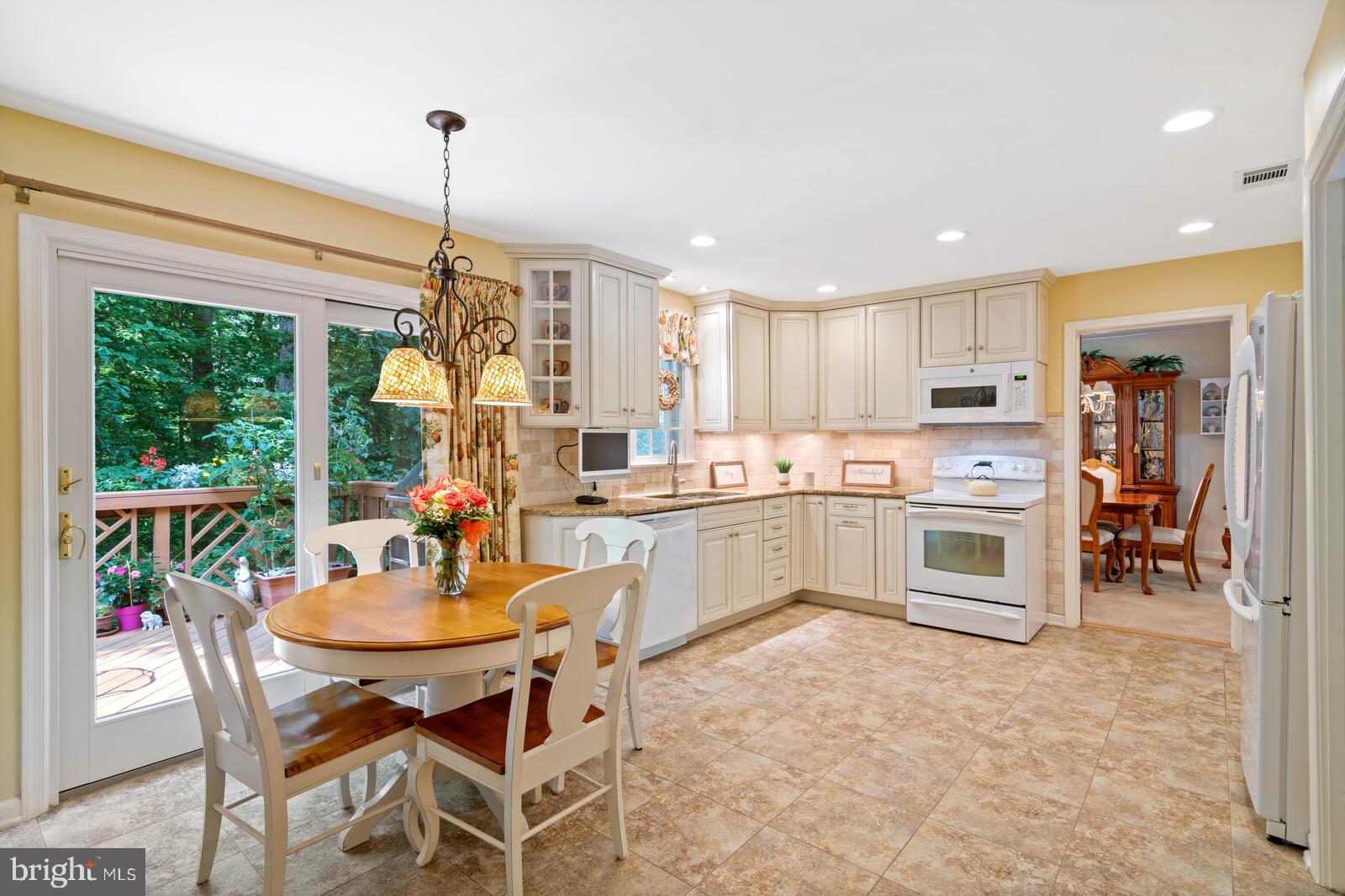 7788 Turlock Road Springfield, VA 22153 - Photo 10 of 65 Eat-in kitchen with patio door to deck