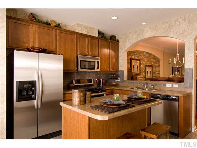 3004 Berkeley Street Raleigh, NC 27612 - Photo 1 of 15 Beautiful kitchen features upgraded maple cabinets, upgraded countertops, kitchen island plus stainless steel appliances! *Model Home Pictured*