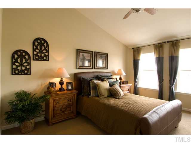 3004 Berkeley Street Raleigh, NC 27612 - Photo 4 of 15 Master suite features vaulted ceilings, plant shelf plus walk in closet. Bathroom comes with spacious garden tub perfect for relaxing after a long day of work! *Model Home Pictured*