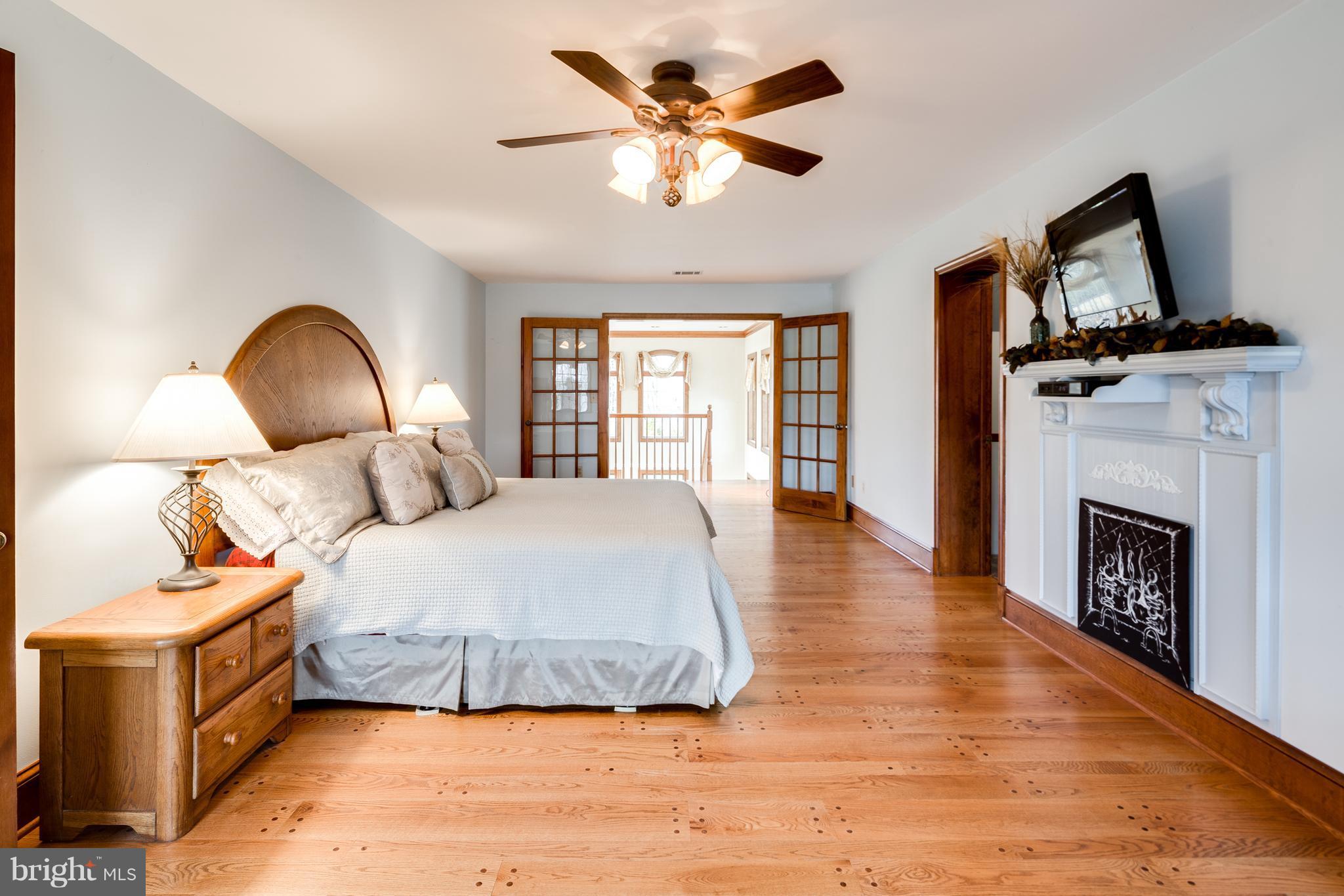 16400 Ed Warfield Road Woodbine, MD 21797 - Photo 22 of 30 Master suite with gleaming hardwood floors
