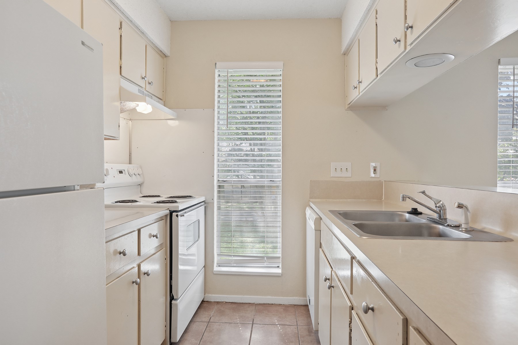 3114 Plantation Road, Unit A Austin, TX 78745 - Photo 7 of 15 Well-lit kitchen with functional appliances and ample cabinet storage.