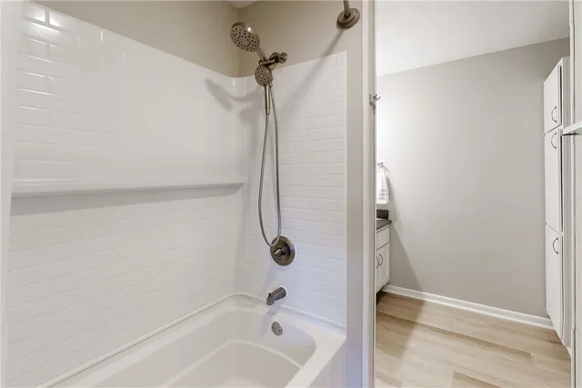 a bathroom with a bathtub and toilet