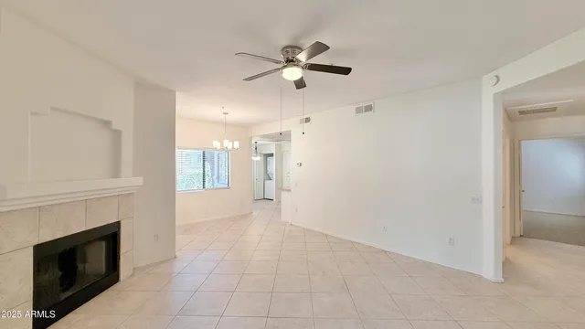 a view of an empty room with a fireplace