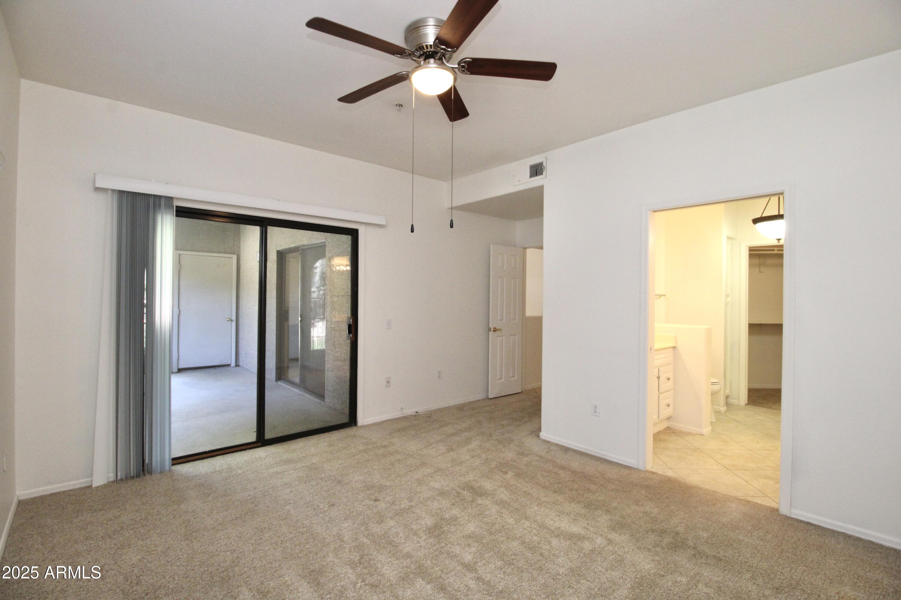 15050 North Thompson Peak Parkway, Unit 1012 Scottsdale, AZ 85260 - Photo 13 of 49 a view of empty room with ceiling fan