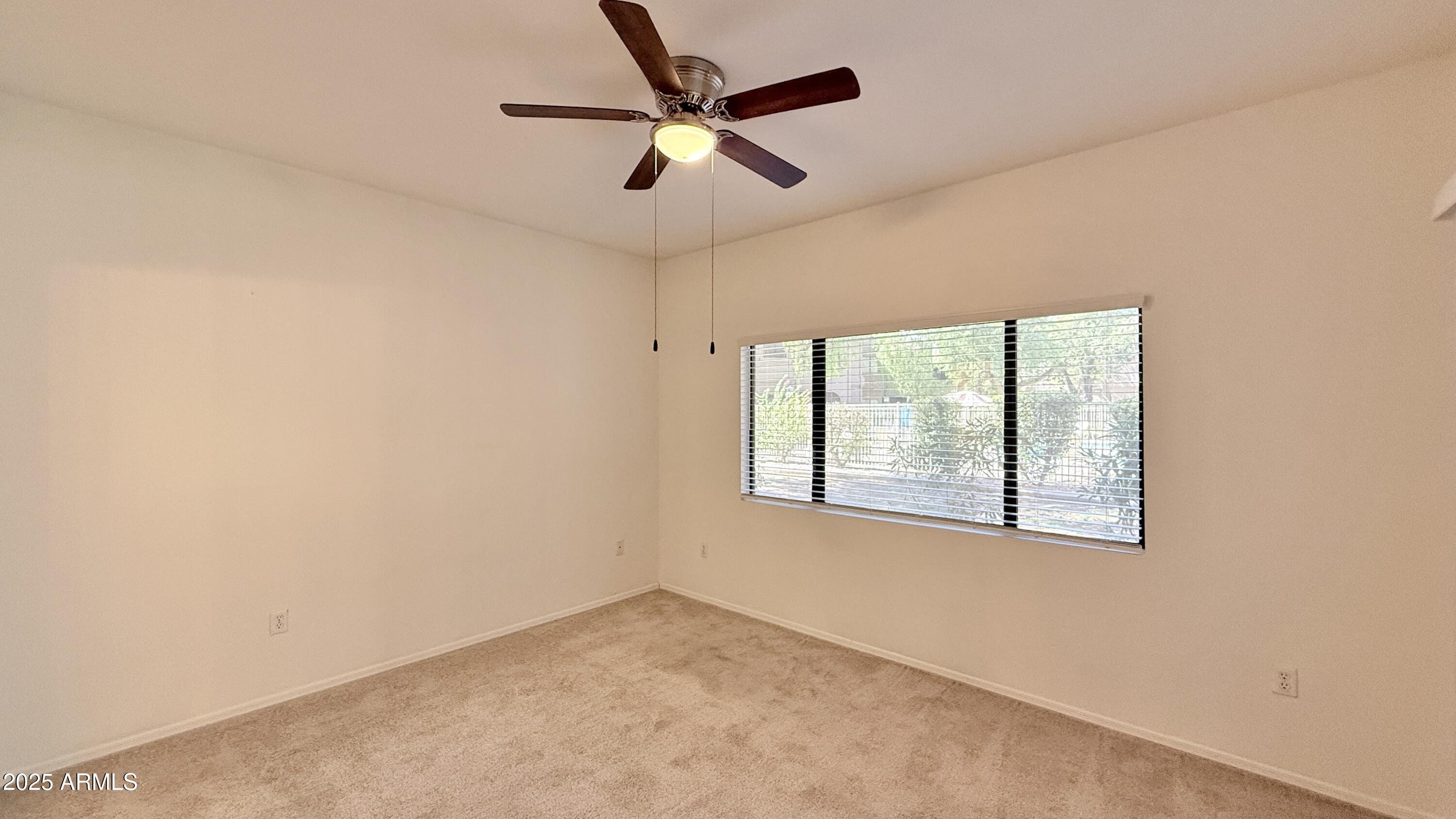 15050 North Thompson Peak Parkway, Unit 1012 Scottsdale, AZ 85260 - Photo 17 of 49 a view of an empty room with a window
