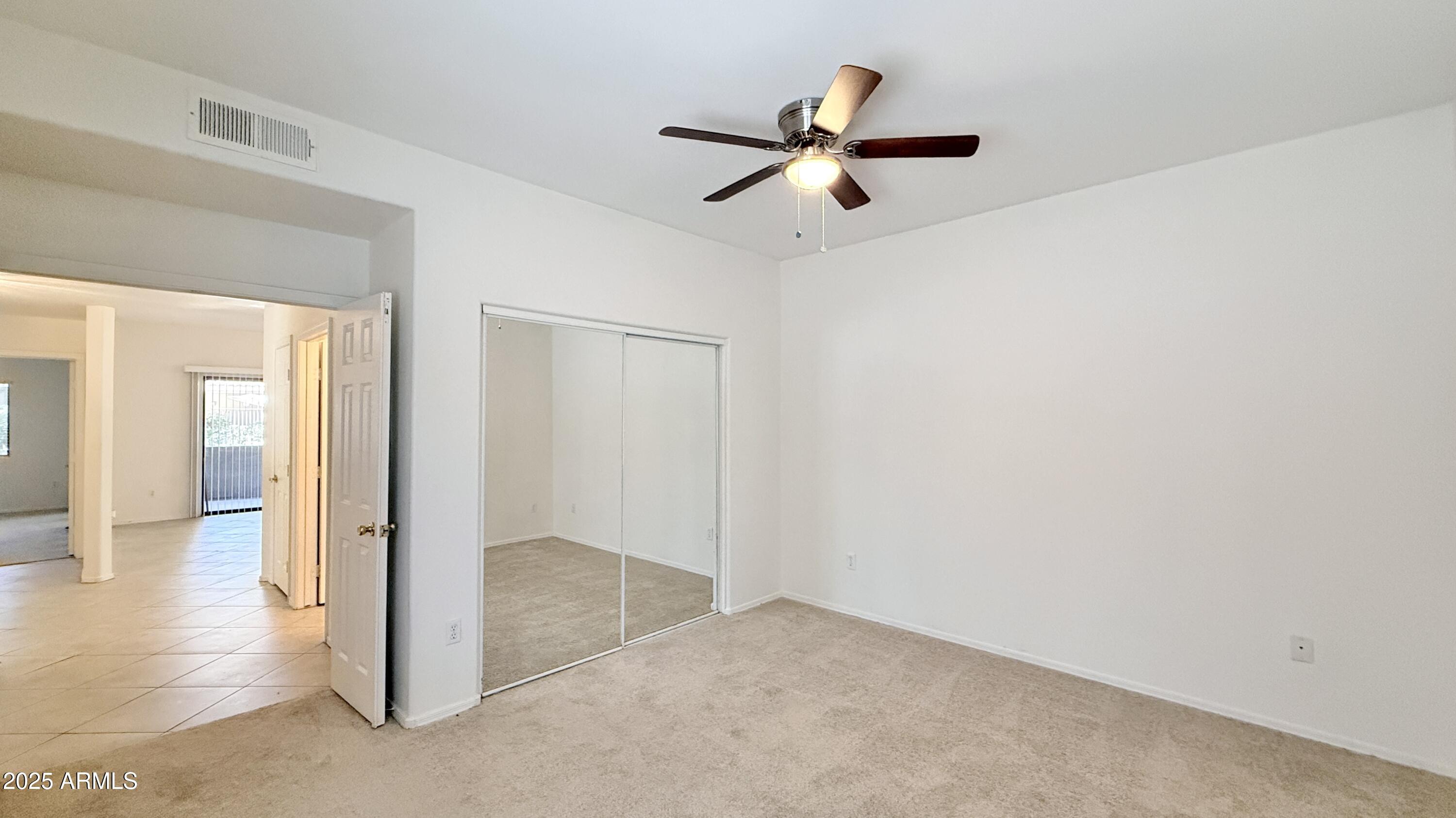 15050 North Thompson Peak Parkway, Unit 1012 Scottsdale, AZ 85260 - Photo 18 of 49 an empty room and wooden floor in a room