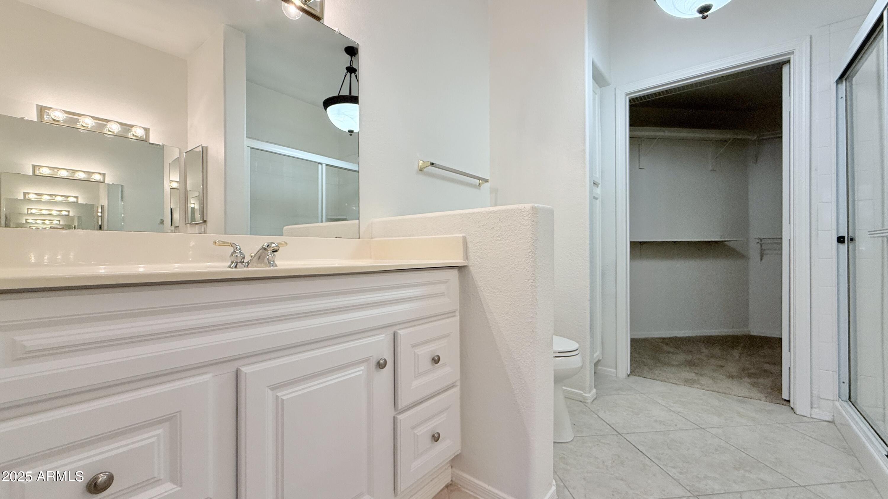 15050 North Thompson Peak Parkway, Unit 1012 Scottsdale, AZ 85260 - Photo 28 of 49 a bathroom with a sink and a mirror