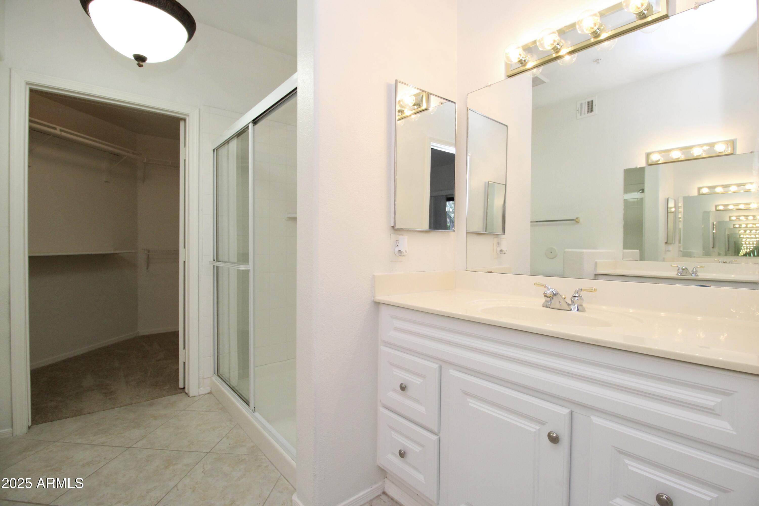 15050 North Thompson Peak Parkway, Unit 1012 Scottsdale, AZ 85260 - Photo 30 of 49 a bathroom with a sink and a mirror