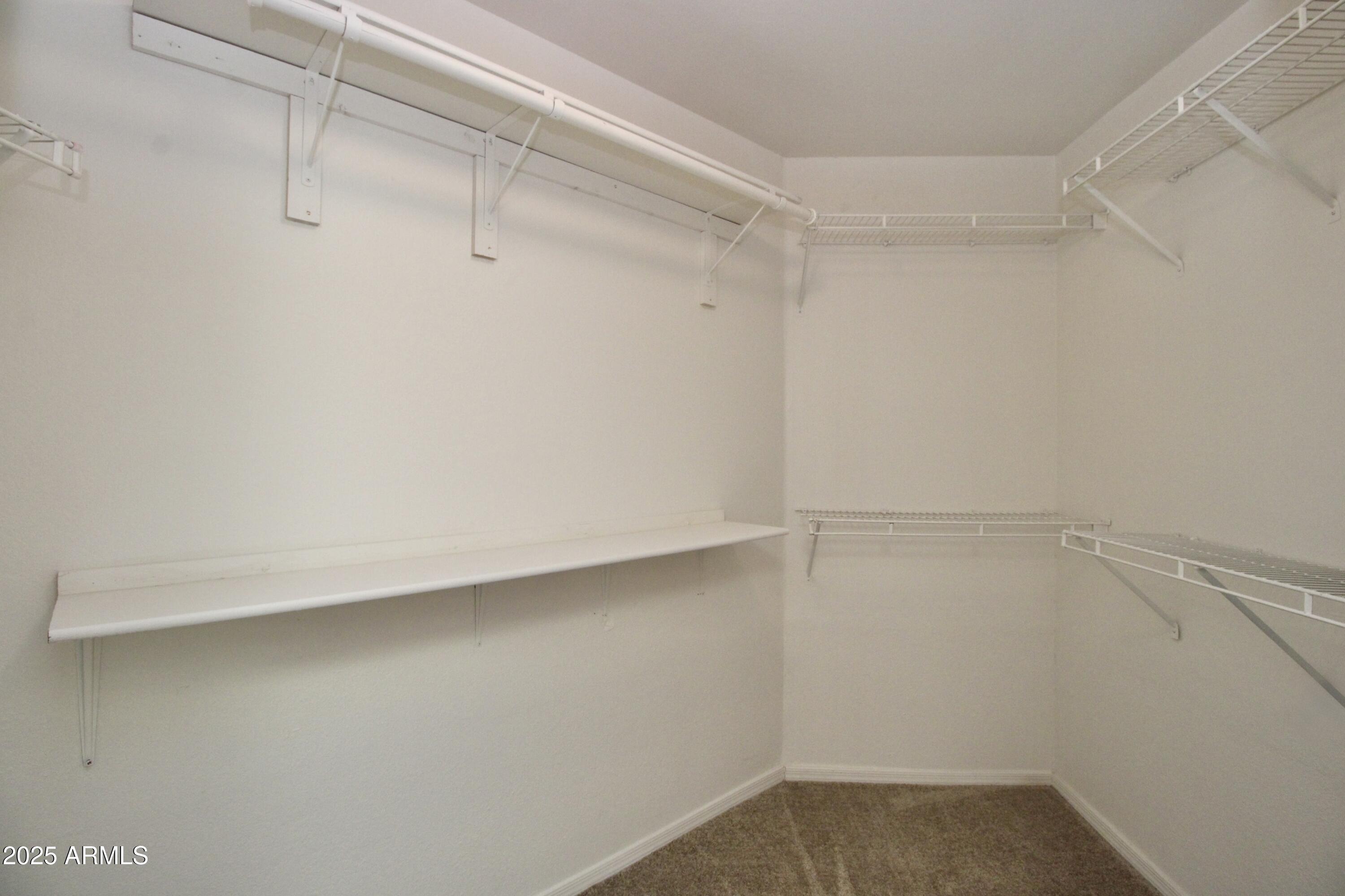 15050 North Thompson Peak Parkway, Unit 1012 Scottsdale, AZ 85260 - Photo 35 of 49 a view of a room with racks on the wall
