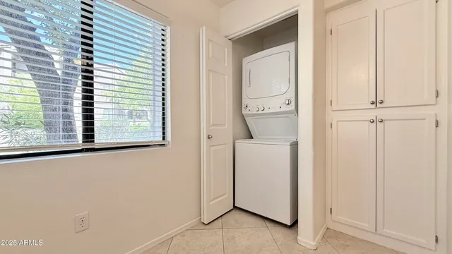 a view of storage and utility room with washer and dryer