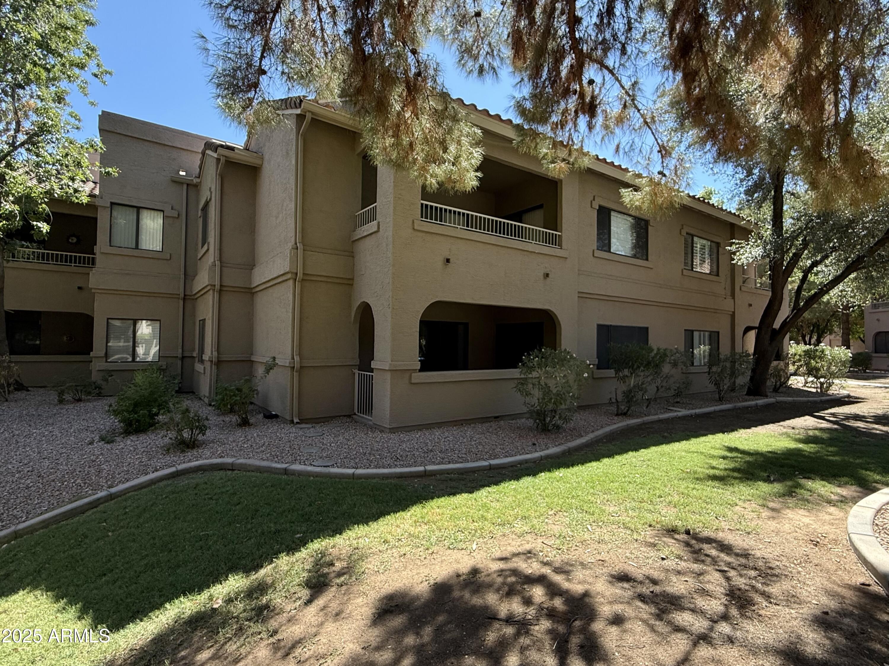 15050 North Thompson Peak Parkway, Unit 1012 Scottsdale, AZ 85260 - Photo 44 of 49 a view of a house with a yard