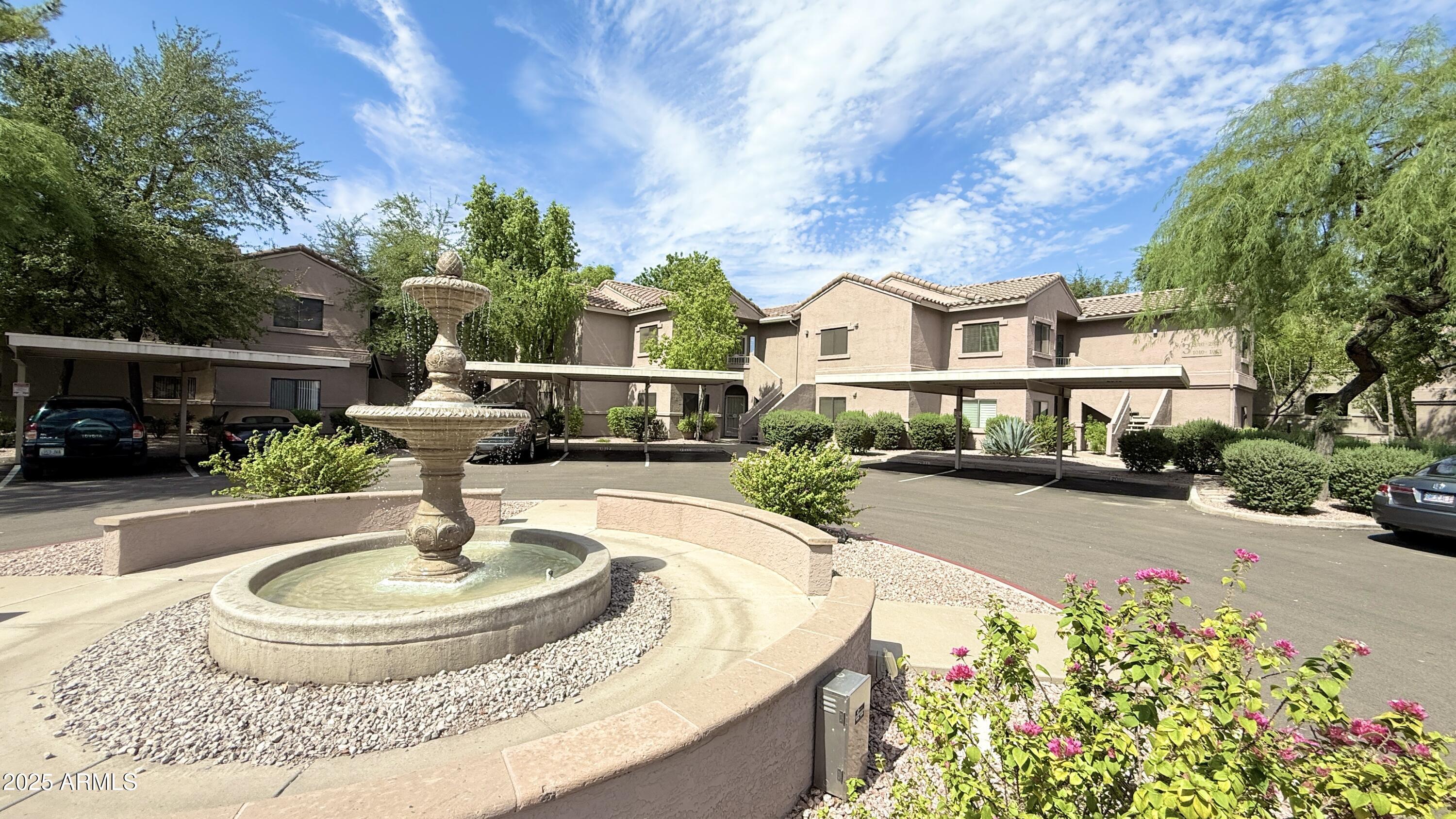 15050 North Thompson Peak Parkway, Unit 1012 Scottsdale, AZ 85260 - Photo 46 of 49 a house view with a garden space