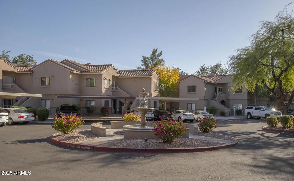 15050 North Thompson Peak Parkway, Unit 1012 Scottsdale, AZ 85260 - Photo 47 of 49 a front view of a building with cars parked