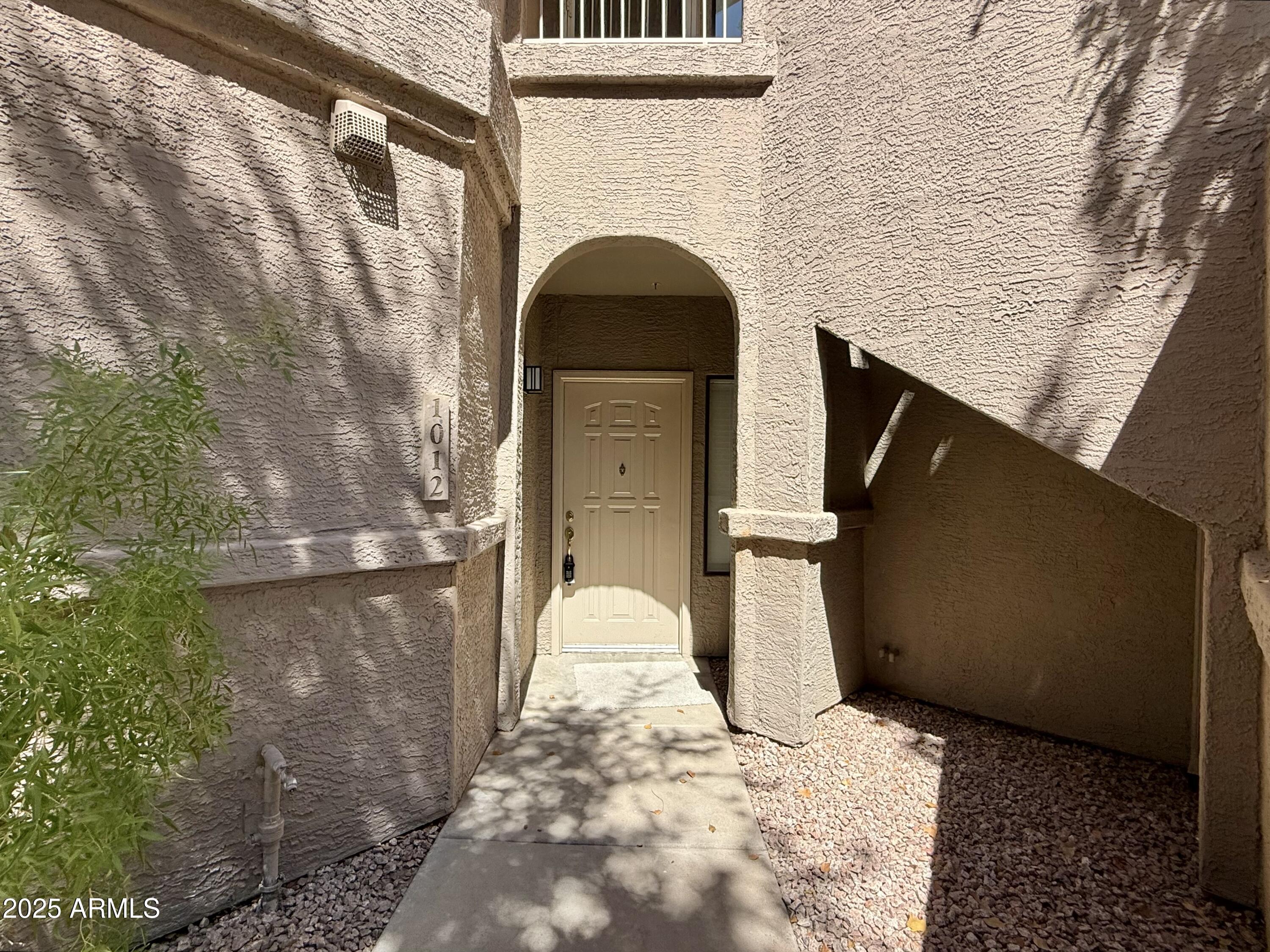 15050 North Thompson Peak Parkway, Unit 1012 Scottsdale, AZ 85260 - Photo 49 of 49 a view of entryway with a outdoor space