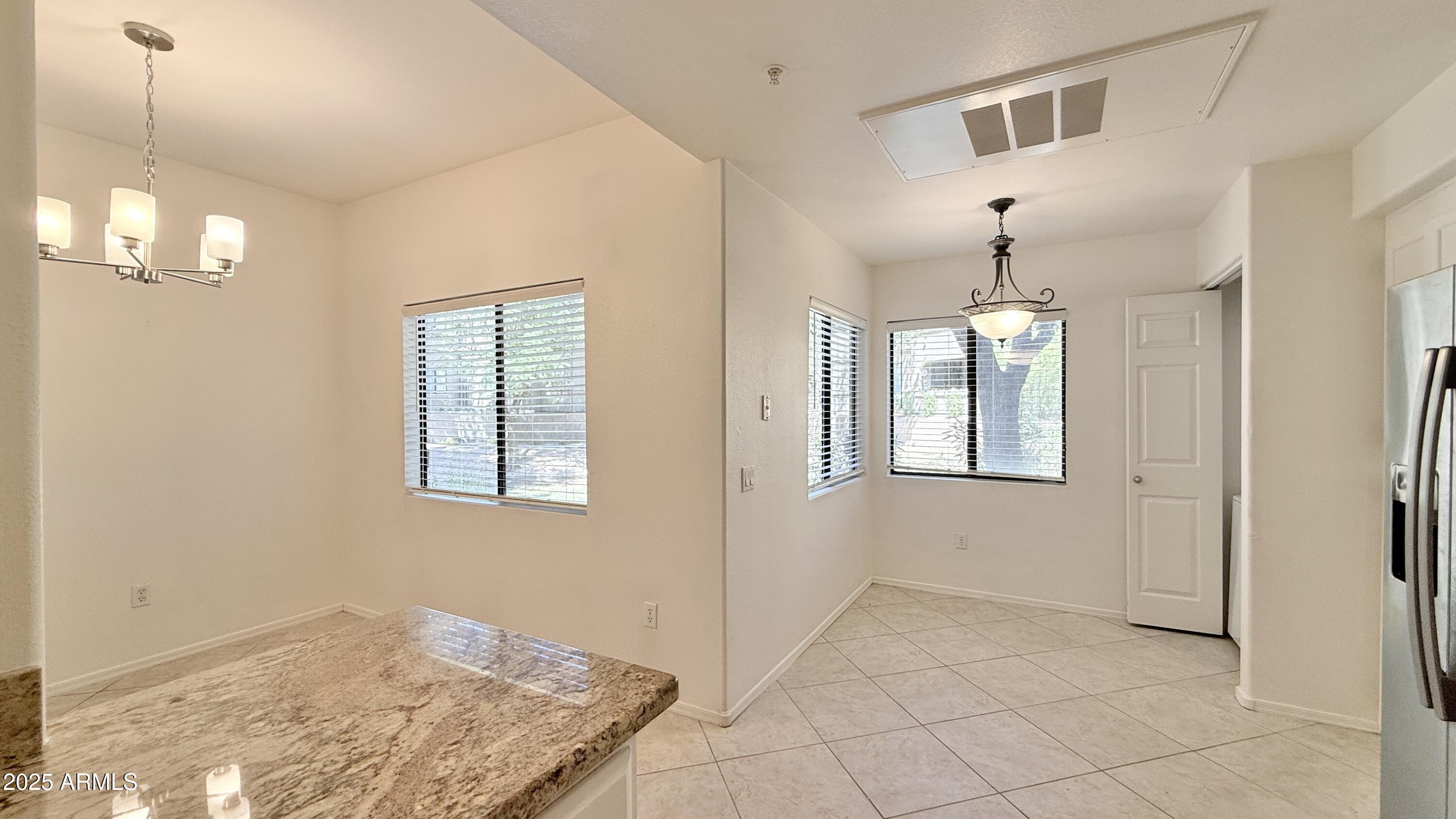 15050 North Thompson Peak Parkway, Unit 1012 Scottsdale, AZ 85260 - Photo 10 of 49 a view of an empty room with a window