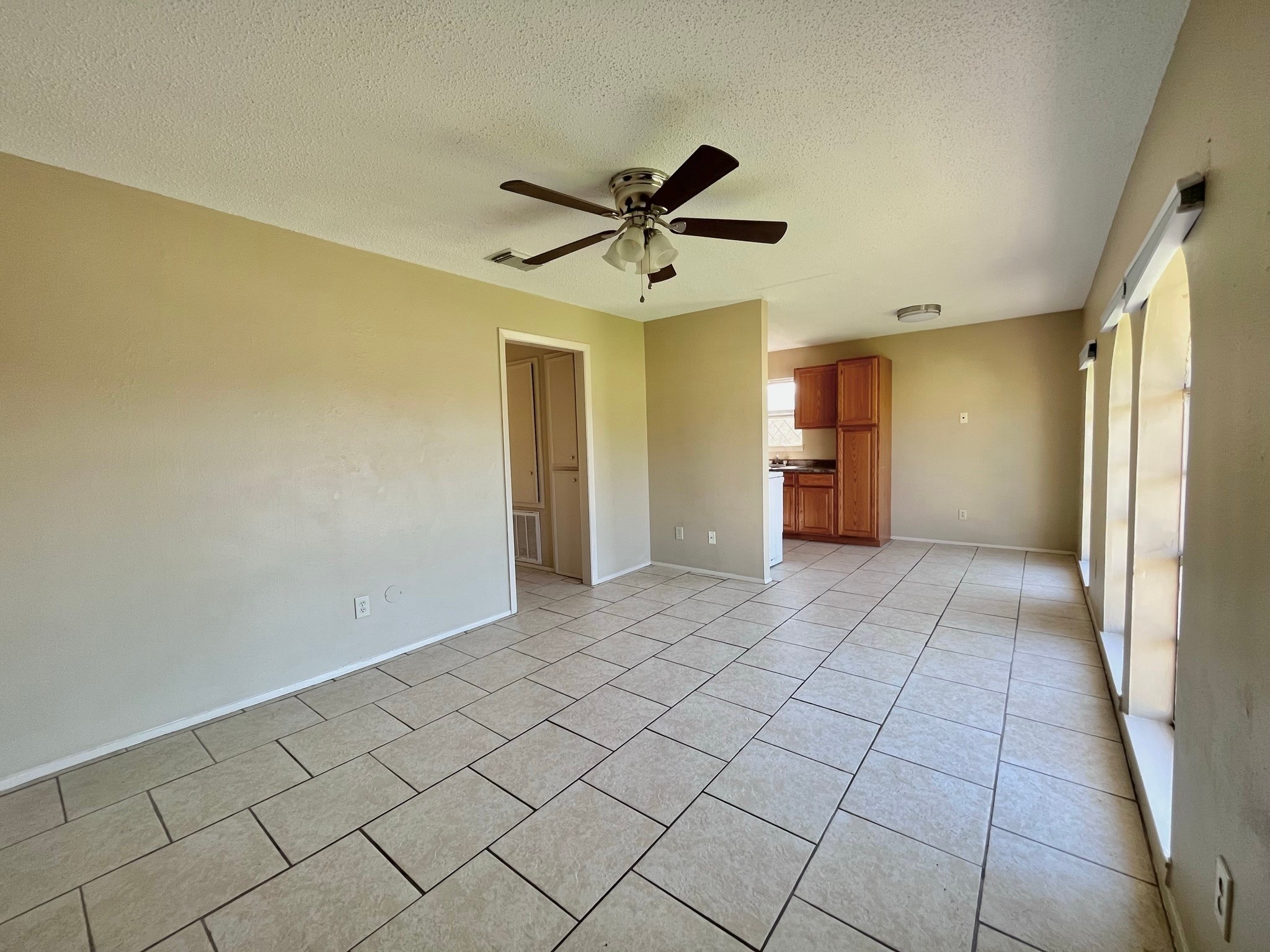 3021 Sycamore Avenue, Unit 10 Bay City, TX 77414 - Photo 1 of 12 a view of a kitchen with a sink and a refrigerator
