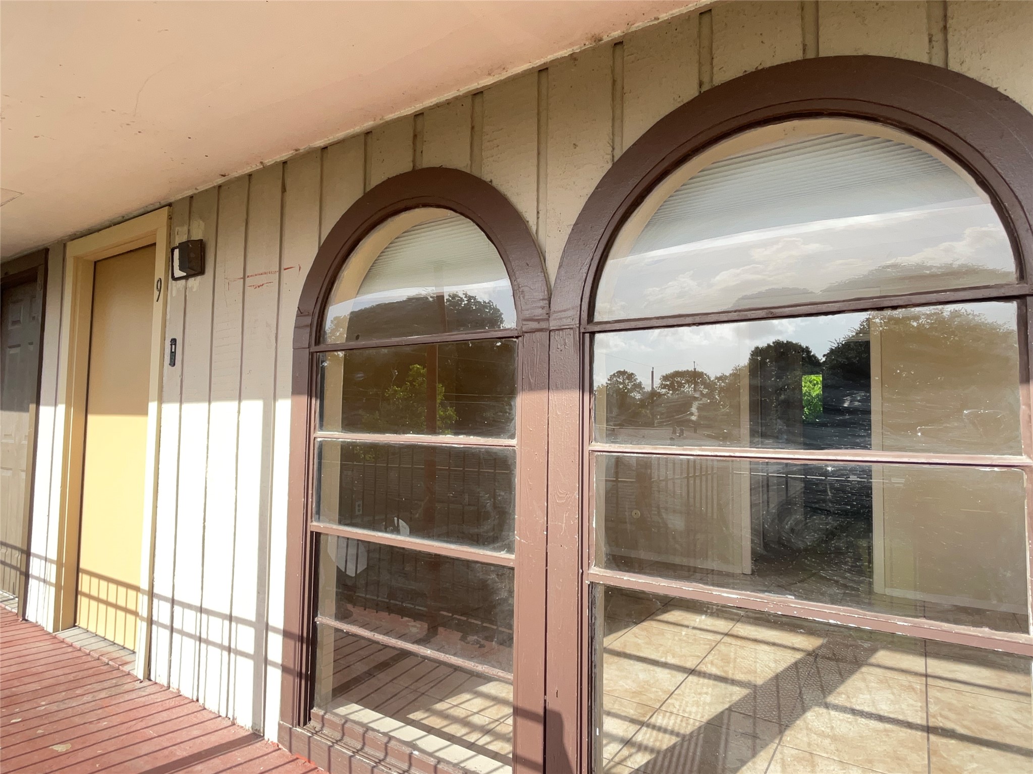 3021 Sycamore Avenue, Unit 10 Bay City, TX 77414 - Photo 11 of 12 a view of a livingroom with wooden floor and a floor to ceiling window